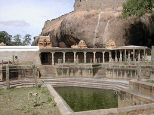 A view of the Vishnu Temple and the of pushkarani with the fort in the background, Thirumayam